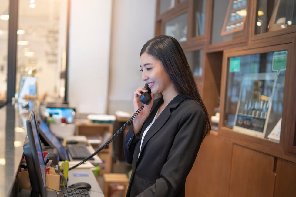 Front Desk Receptionist on the Phone